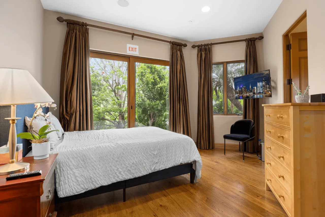 View of a bedroom with big window and lots of natural light in our residential treatment center